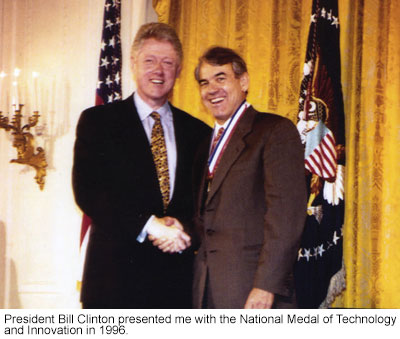 President Bill Clinton shaking hands with Jim Morgan, who wears the National Medal of Technology and Innovation, 1996.